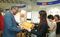 Dating is serious business . . . participants making the rounds at the exhibition booths