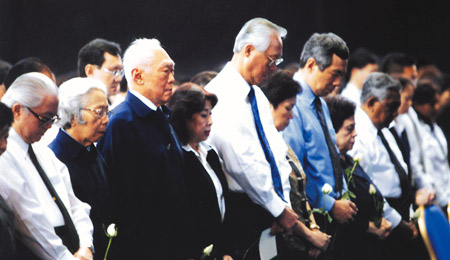 Observing a minute of silence. Source: National Heritage Board 