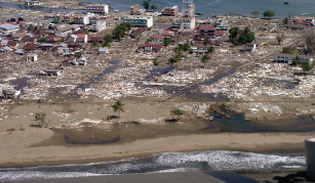 An aerial photo showing the extent of the damage caused by the Tsunami in Meulaboh, Indonesia. Source: Singapore Red Cross Society. 