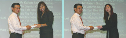 Ms Vivienne Ng and Ms Michelle Ho receive their awards from Minister for Home Affairs, Mr Wong Kan Seng.